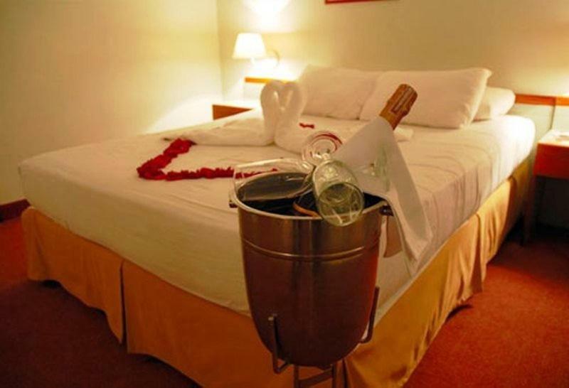 Hotel Cristina Suites Puerto La Cruz Номер фото